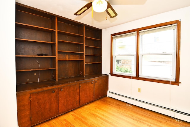 46 Millis St, Hamden, CT 06514 - empty room with a baseboard heating unit, light wood finished floors, and ceiling fan