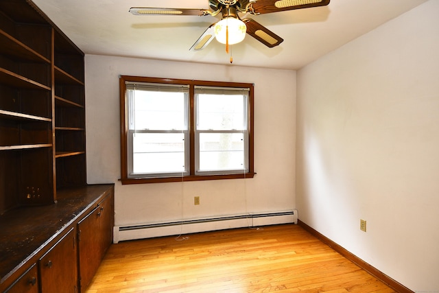 46 Millis St, Hamden, CT 06514 - spare room featuring a baseboard radiator, light wood finished floors, and a ceiling fan