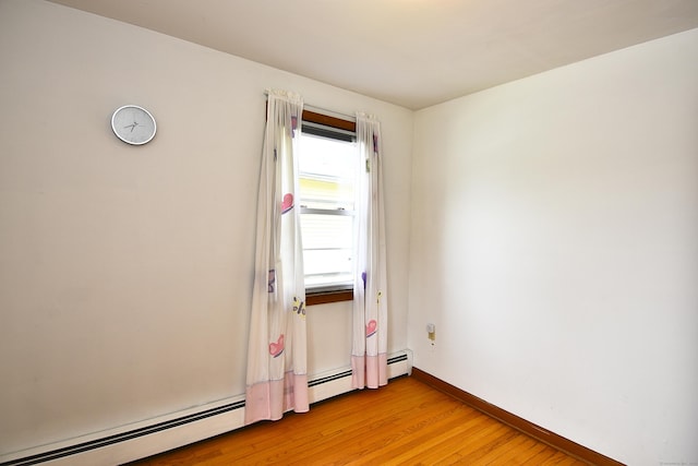 46 Millis St, Hamden, CT 06514 - spare room with light wood-style floors and a baseboard heating unit