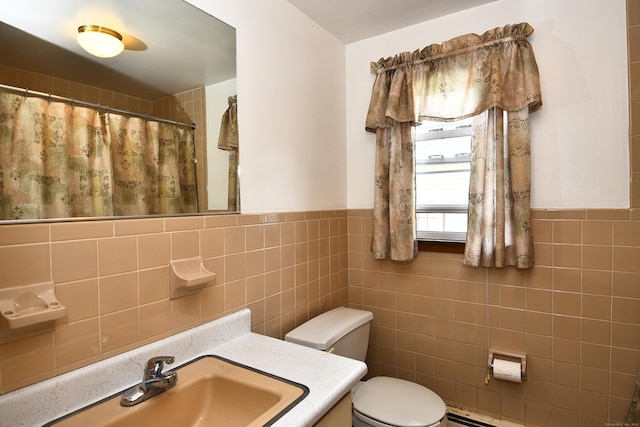46 Millis St, Hamden, CT 06514 - bathroom featuring tile walls, vanity, wainscoting, and a shower with curtain