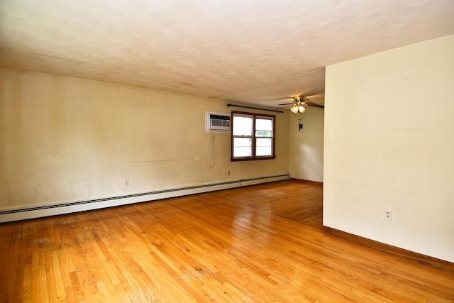 46 Millis St, Hamden, CT 06514 - unfurnished room featuring baseboard heating, hardwood / wood-style floors, a wall unit AC, ceiling fan, and a textured ceiling