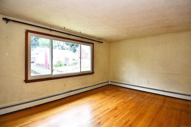 46 Millis St, Hamden, CT 06514 - unfurnished room featuring wood finished floors and baseboard heating