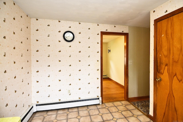 46 Millis St, Hamden, CT 06514 - empty room featuring wallpapered walls, baseboard heating, and a baseboard radiator