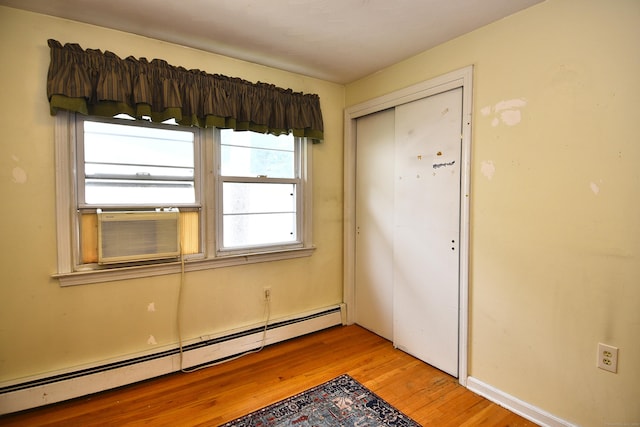 46 Millis St, Hamden, CT 06514 - entryway featuring a baseboard heating unit, light wood-type flooring, and plenty of natural light