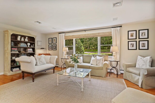 78 Kings Hwy S, Westport, CT 06880 - living room with baseboard heating and wood finished floors