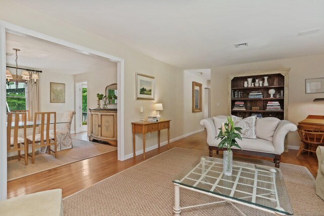 78 Kings Hwy S, Westport, CT 06880 - living area featuring a chandelier and wood finished floors