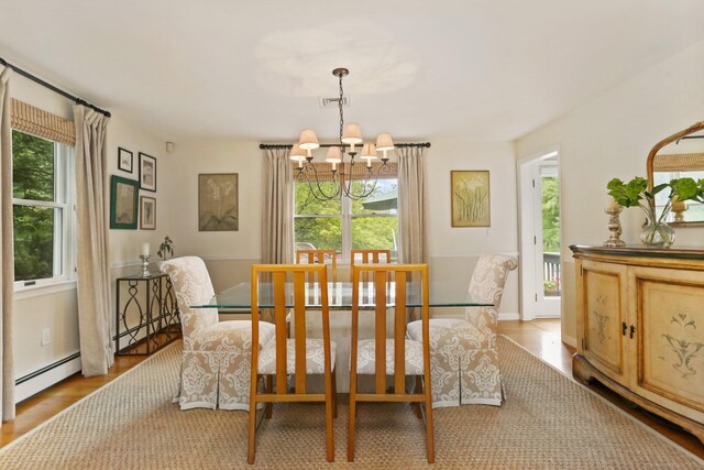 78 Kings Hwy S, Westport, CT 06880 - dining room with a baseboard heating unit, a chandelier, and healthy amount of natural light