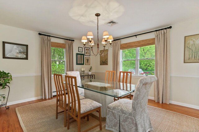 78 Kings Hwy S, Westport, CT 06880 - dining room with a chandelier, a baseboard heating unit, plenty of natural light, and wood finished floors