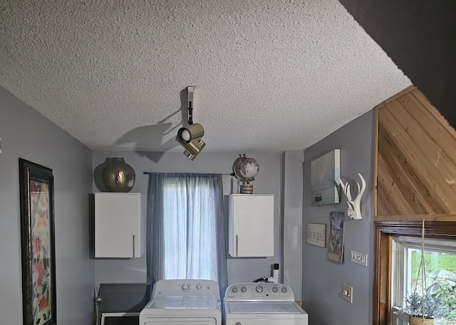 33 Tanner Ave, Norwich, CT 06360 - laundry area featuring washer and dryer and a textured ceiling