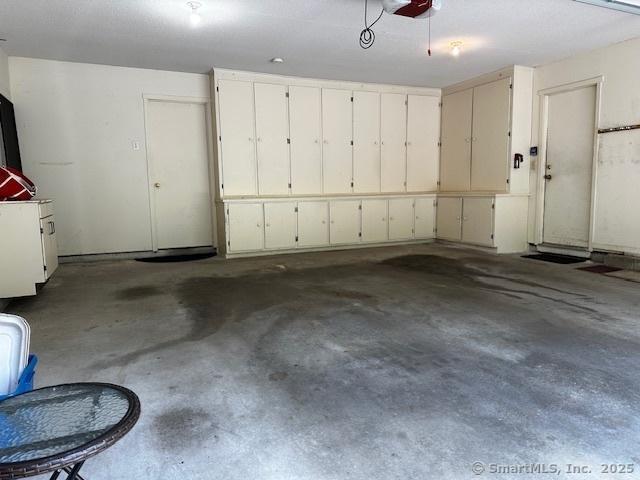 4 Heritage Crst Unit A, Southbury, CT 06488 - garage featuring a garage door opener