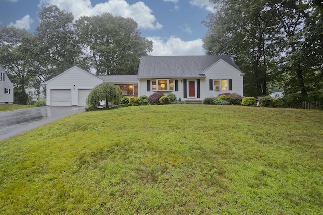 4 Birchwood Ter, Enfield, CT 06082 - view of front of house with driveway, an attached garage, and a front yard