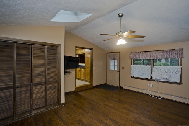 4 Birchwood Ter, Enfield, CT 06082 - unfurnished living room featuring a skylight, a baseboard heating unit, wood finished floors, vaulted ceiling, and ceiling fan