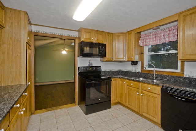 4 Birchwood Ter, Enfield, CT 06082 - kitchen with black appliances, a ceiling fan, dark stone counters, and light tile patterned flooring