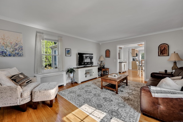 44 Durwin St, Middletown, CT 06457 - living room featuring radiator, ornamental molding, and wood finished floors