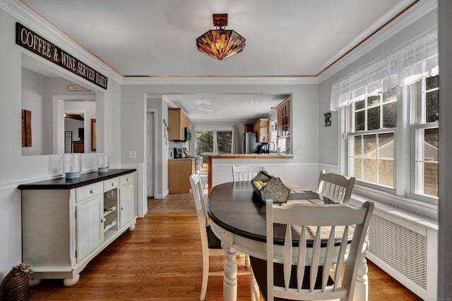 44 Durwin St, Middletown, CT 06457 - dining area featuring wainscoting, wood finished floors, and crown molding