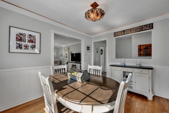 44 Durwin St, Middletown, CT 06457 - dining area with a wainscoted wall, light wood-type flooring, and ornamental molding