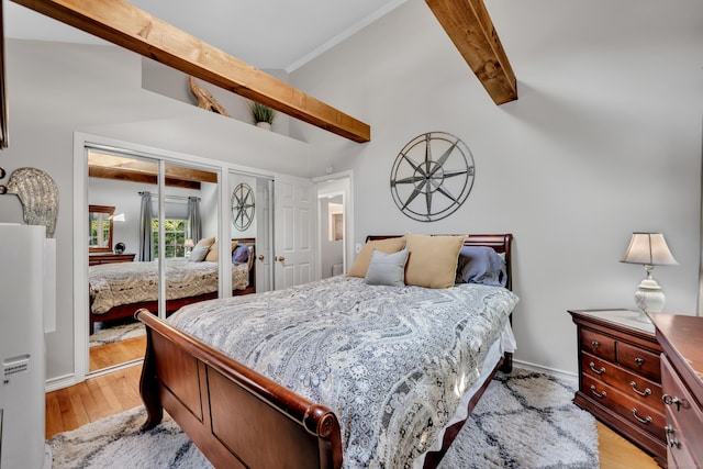 44 Durwin St, Middletown, CT 06457 - bedroom featuring beam ceiling, two closets, light wood-style flooring, high vaulted ceiling, and crown molding