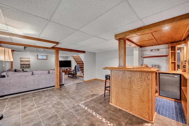 44 Durwin St, Middletown, CT 06457 - kitchen featuring stainless steel fridge, open floor plan, a drop ceiling, tile patterned floors, and a kitchen breakfast bar