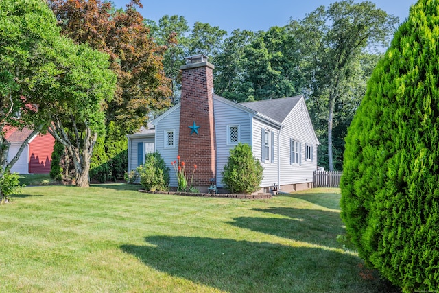 44 Durwin St, Middletown, CT 06457 - view of property exterior with a chimney, a lawn, and roof with shingles