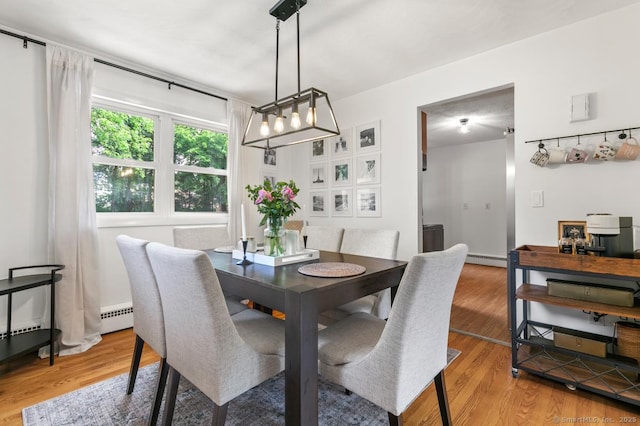 1762 Waterbury Rd, Cheshire, CT 06410 - dining space featuring light wood finished floors and baseboard heating