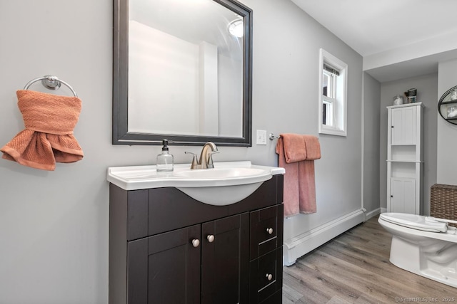 1762 Waterbury Rd, Cheshire, CT 06410 - bathroom with baseboard heating, wood finished floors, and vanity
