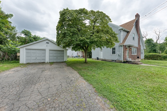 7 Ellsworth St, East Hartford, CT 06108 - view of front of home featuring an outbuilding, a garage, a chimney, and a front yard