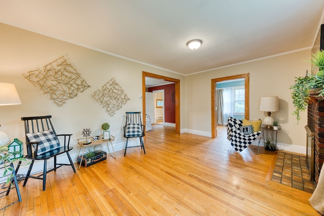 7 Ellsworth St, East Hartford, CT 06108 - living area with hardwood / wood-style floors and ornamental molding