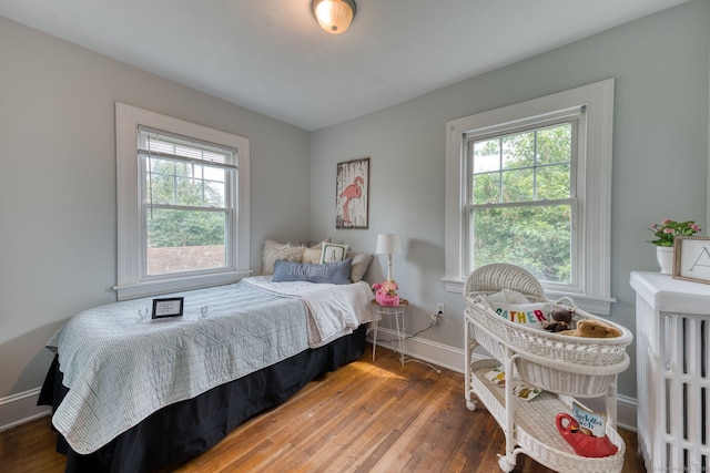 7 Ellsworth St, East Hartford, CT 06108 - bedroom featuring multiple windows and hardwood / wood-style flooring