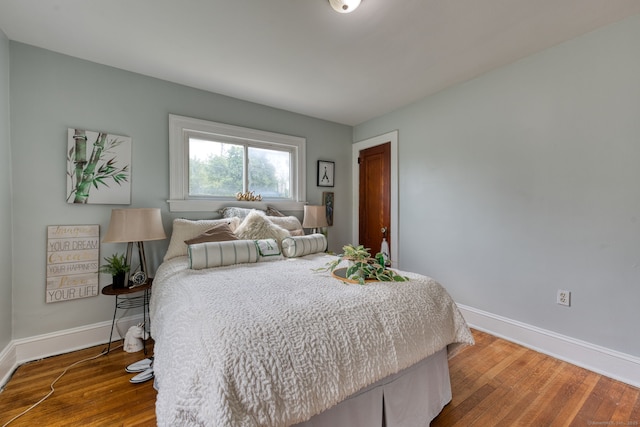 7 Ellsworth St, East Hartford, CT 06108 - bedroom with baseboards and wood finished floors