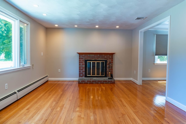 76 Brookview Rd, Windsor, CT 06095 - unfurnished living room with a baseboard radiator, hardwood / wood-style flooring, plenty of natural light, recessed lighting, and a fireplace