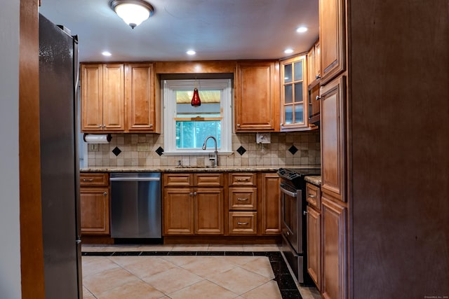 76 Brookview Rd, Windsor, CT 06095 - kitchen with appliances with stainless steel finishes, brown cabinets, backsplash, light stone countertops, and recessed lighting