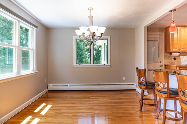 76 Brookview Rd, Windsor, CT 06095 - dining area featuring a baseboard radiator, plenty of natural light, a chandelier, and light wood finished floors