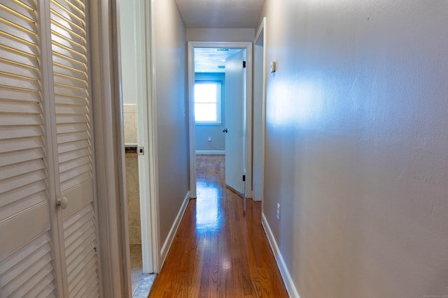 76 Brookview Rd, Windsor, CT 06095 - hallway featuring wood finished floors and baseboards