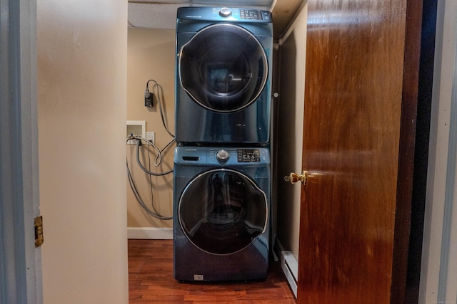 76 Brookview Rd, Windsor, CT 06095 - laundry room with stacked washer / dryer, a baseboard radiator, and wood finished floors
