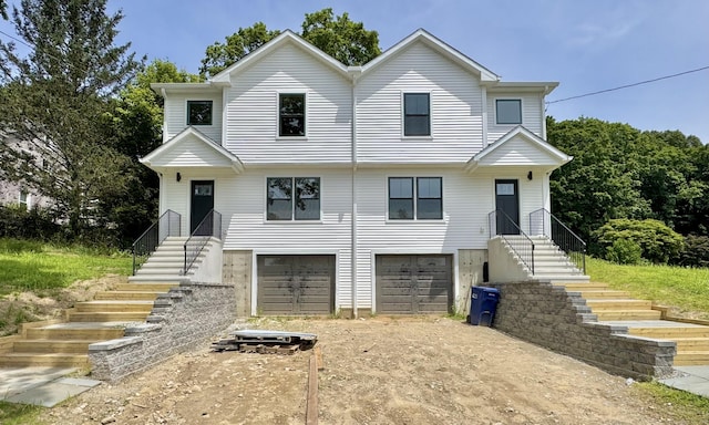 55A Moulthrop St, Ansonia, CT 06401 - view of front of house with stairs, an attached garage, and dirt driveway
