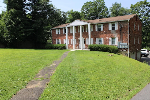 66 Long Meadow Hill Rd Unit 1, Brookfield, CT 06804 - greek revival house featuring a front lawn, brick siding, and a garage