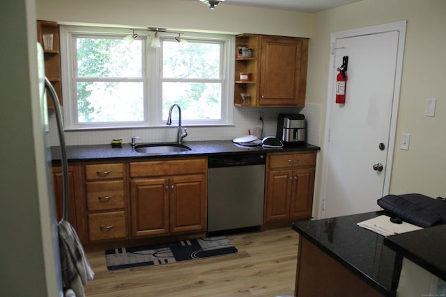 66 Long Meadow Hill Rd Unit 1, Brookfield, CT 06804 - kitchen with stainless steel appliances, backsplash, brown cabinetry, and light wood finished floors