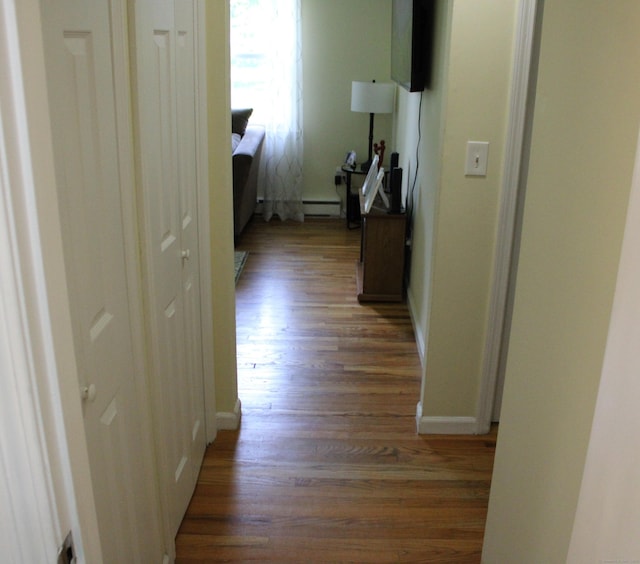 66 Long Meadow Hill Rd Unit 1, Brookfield, CT 06804 - corridor featuring wood finished floors and a baseboard heating unit