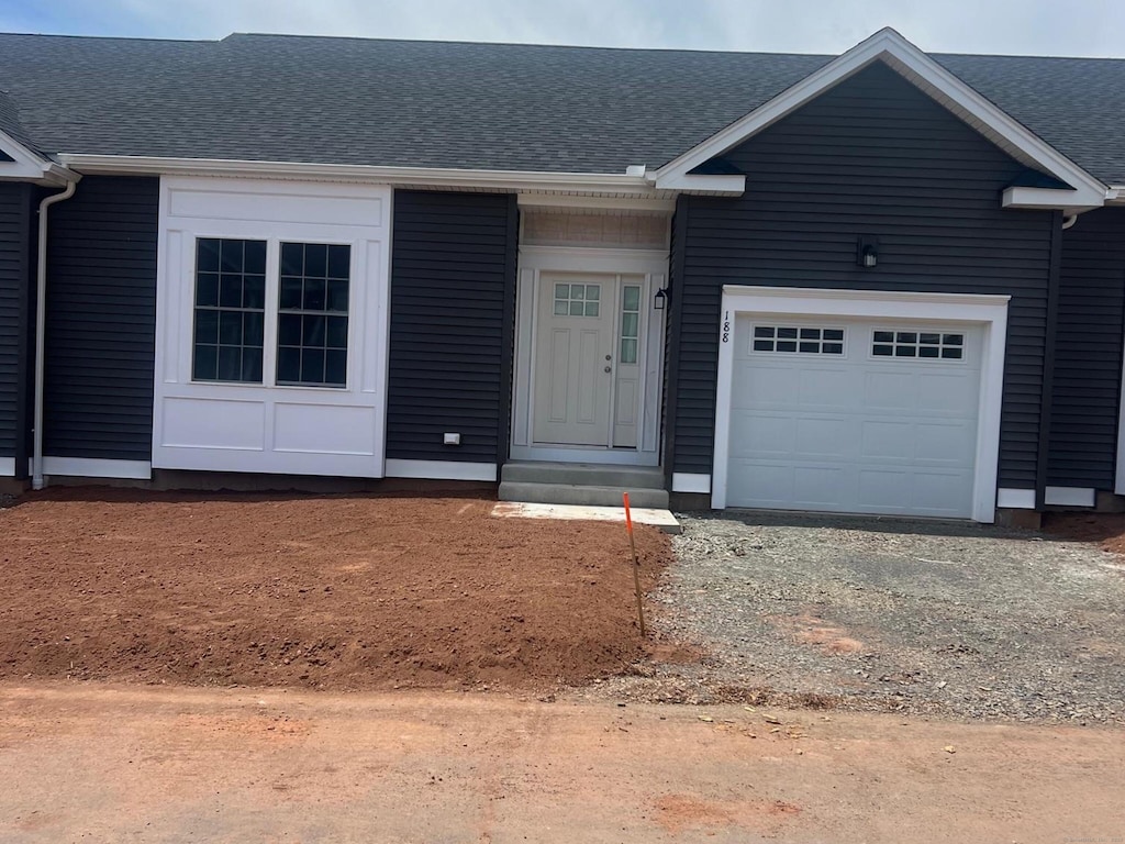 90 Apple Gate Unit 188, Southington, CT 06489 - view of front facade featuring a garage and a shingled roof