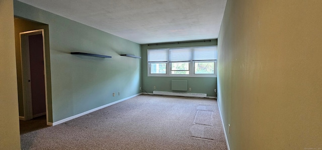 285 Savin Ave Apt B4, West Haven, CT 06516 - carpeted empty room with a baseboard radiator and baseboards