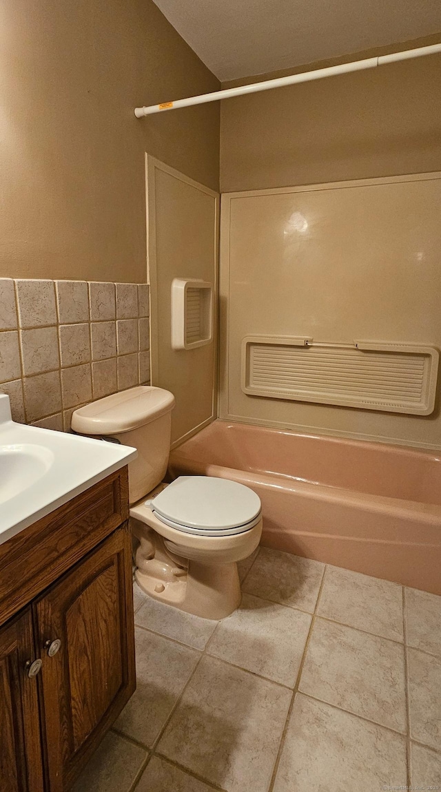 285 Savin Ave Apt B4, West Haven, CT 06516 - bathroom with tile walls, vanity, shower / tub combination, tile patterned flooring, and wainscoting
