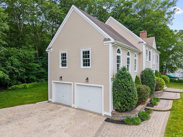11 Acorn Dr, East Haddam, CT 06423 - view of home's exterior with a garage, driveway, a chimney, a yard, and roof with shingles
