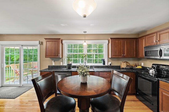 11 Acorn Dr, East Haddam, CT 06423 - kitchen with stainless steel appliances, light wood finished floors, hanging light fixtures, and brown cabinetry