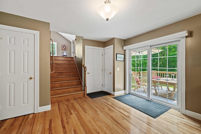 11 Acorn Dr, East Haddam, CT 06423 - entrance foyer with light wood-style floors and stairway