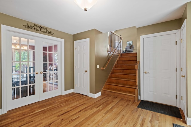 11 Acorn Dr, East Haddam, CT 06423 - foyer with light wood-style flooring, french doors, and stairs