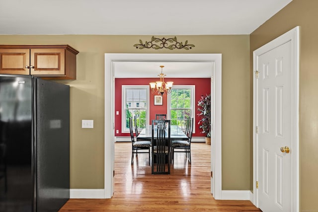 11 Acorn Dr, East Haddam, CT 06423 - dining area featuring light wood finished floors and a chandelier