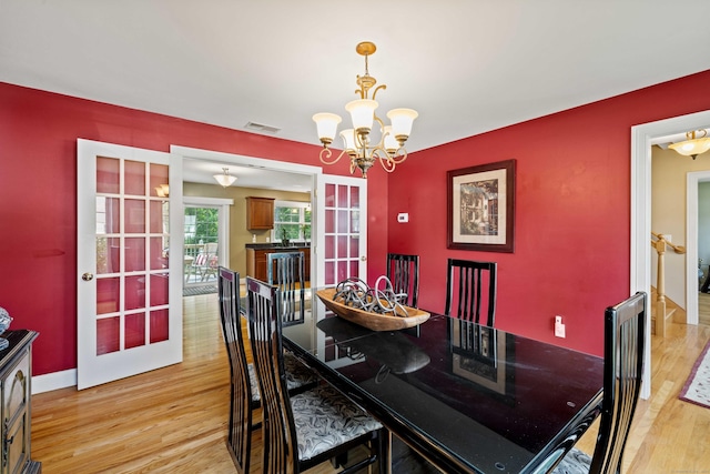 11 Acorn Dr, East Haddam, CT 06423 - dining area featuring a chandelier and light wood-style floors