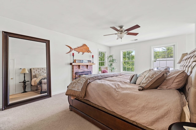 11 Acorn Dr, East Haddam, CT 06423 - bedroom with carpet flooring, a ceiling fan, and a brick fireplace