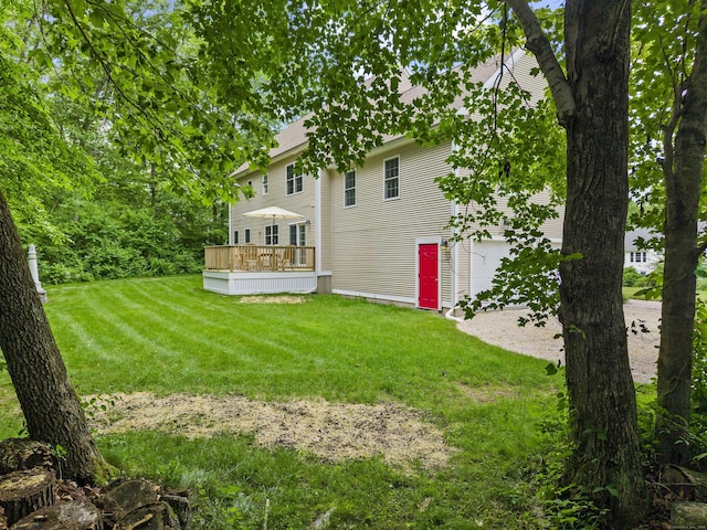 11 Acorn Dr, East Haddam, CT 06423 - view of grassy yard featuring a deck and a garage