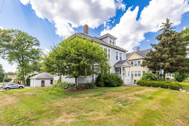 205 Wolcott Hill Rd, Wethersfield, CT 06109 - traditional style home with a garage, a front yard, and a chimney